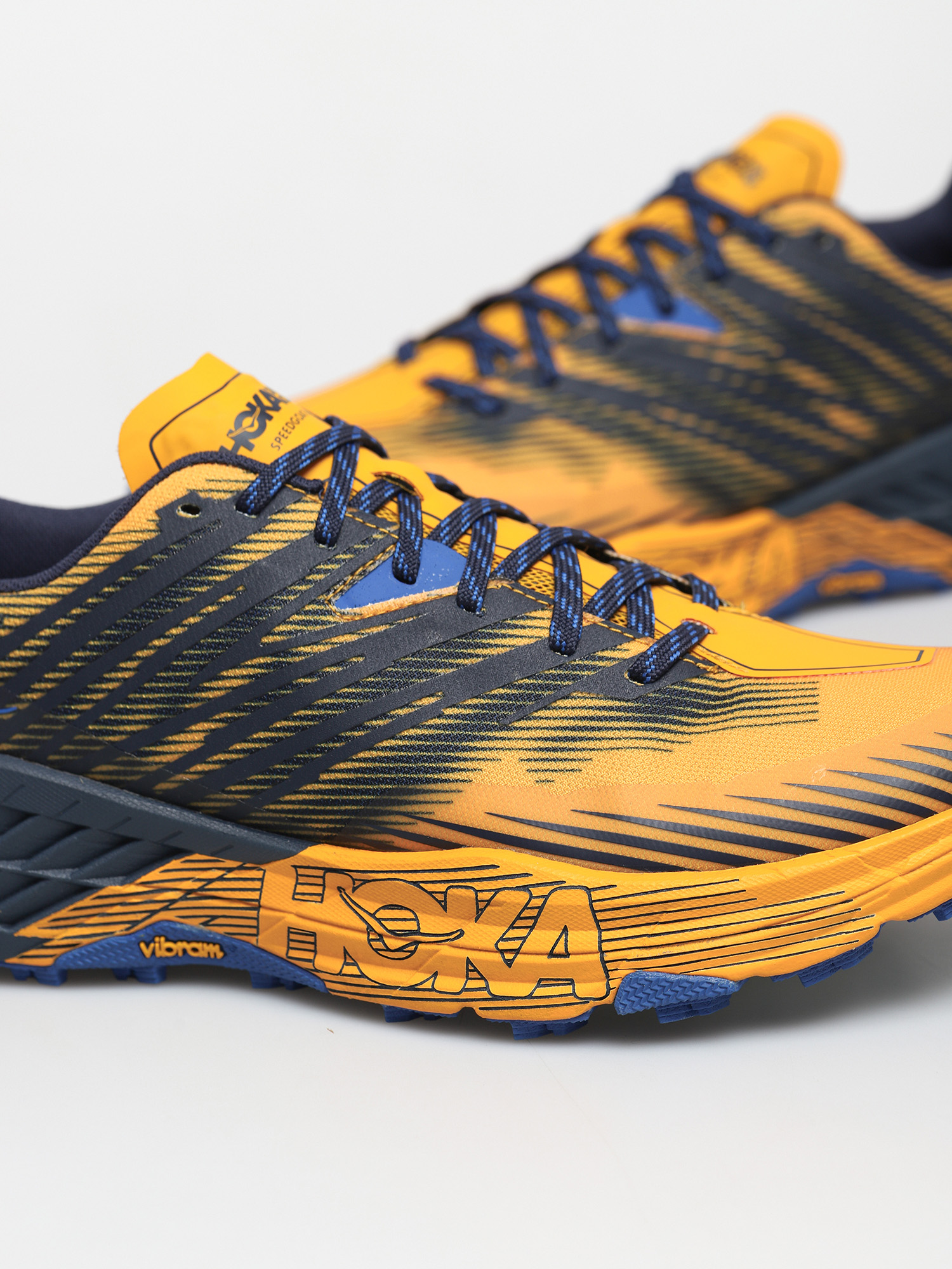 Hoka One One Speedgoat 4 Cipők (saffron/black iris)