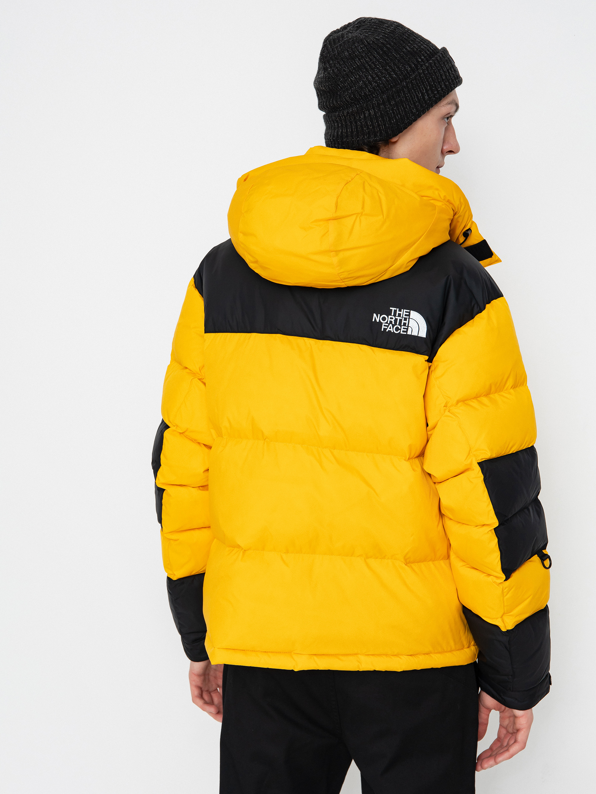The North Face Hmlyn Baltoro Dzseki (summit gold tnf black n)