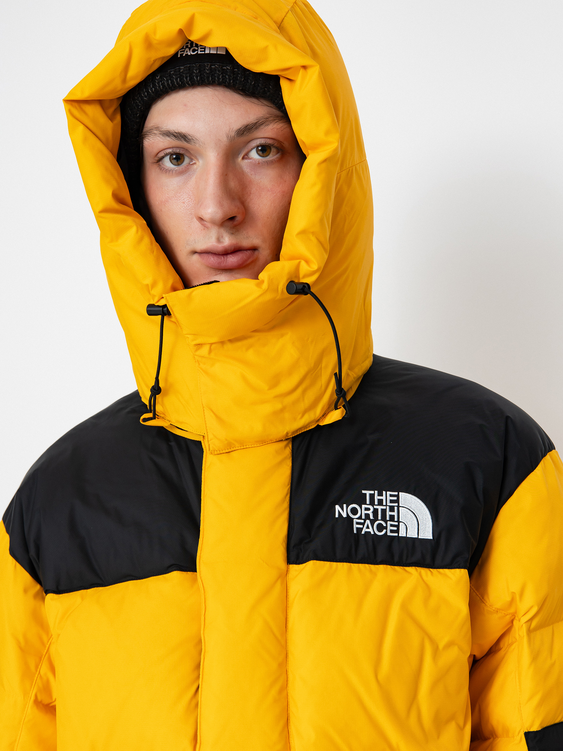 The North Face Hmlyn Baltoro Dzseki (summit gold tnf black n)