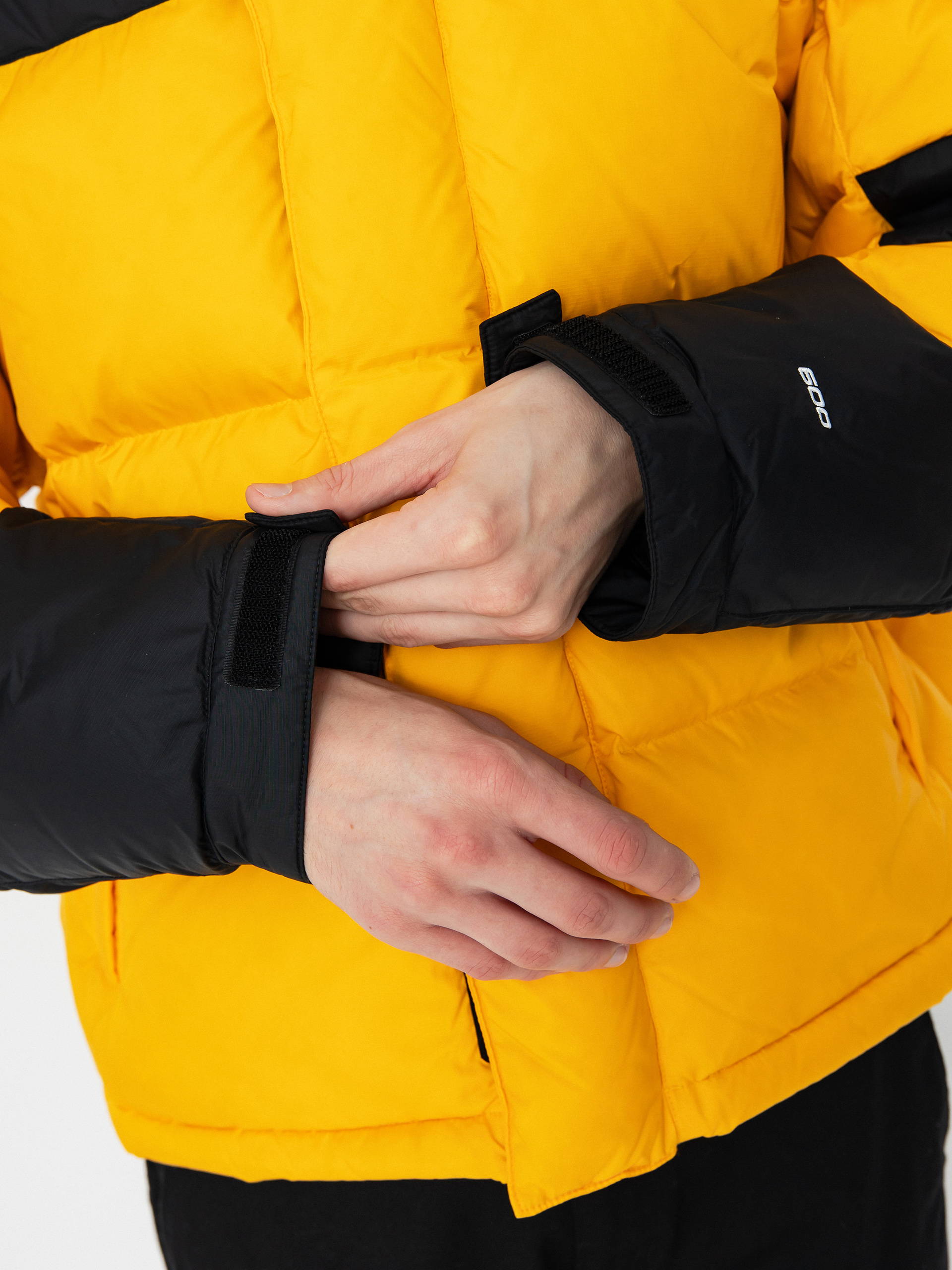 The North Face Hmlyn Baltoro Dzseki (summit gold tnf black n)
