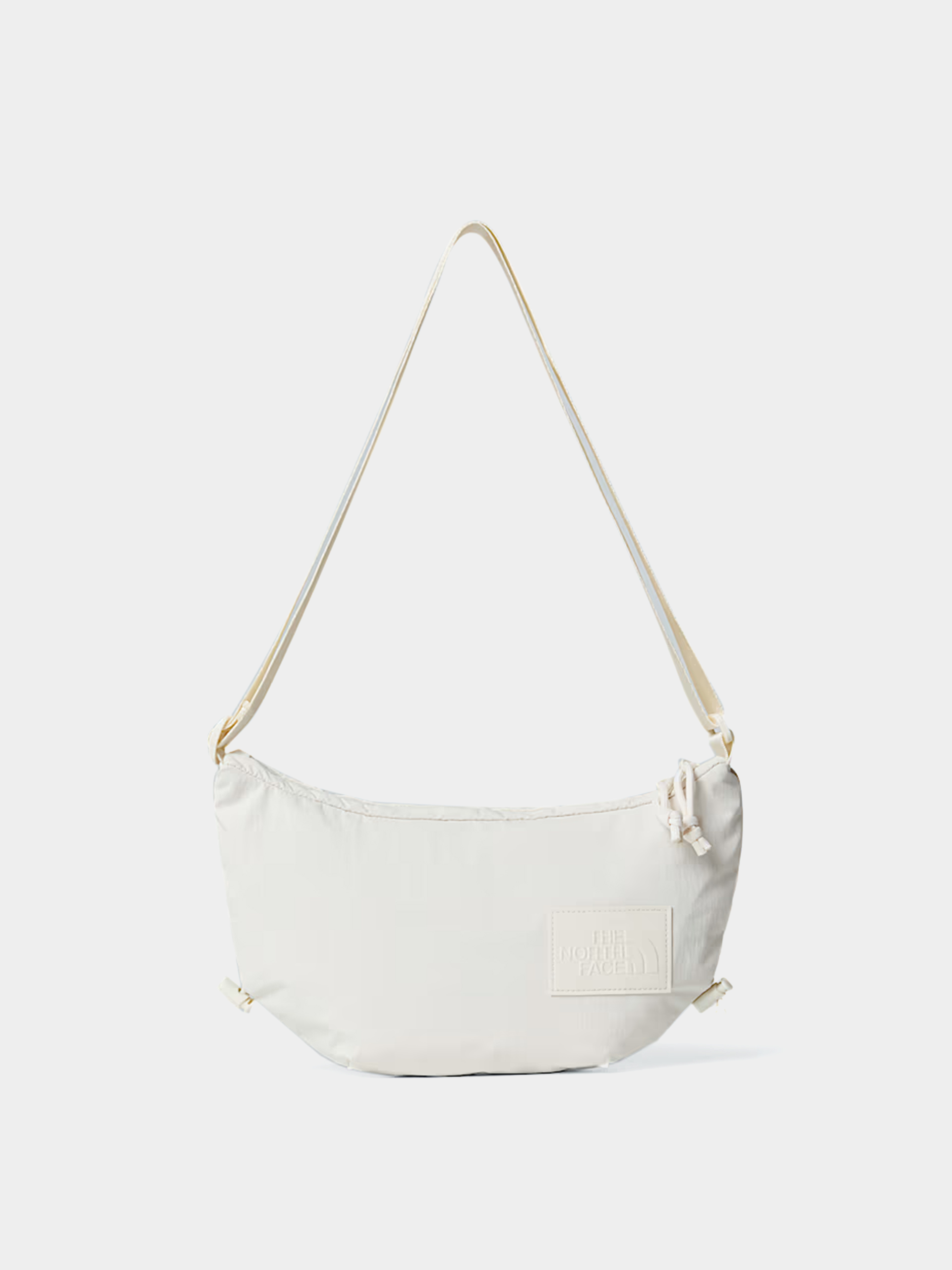 Kézitáska The North Face Never Stop Crossbody Wmn (white dune)