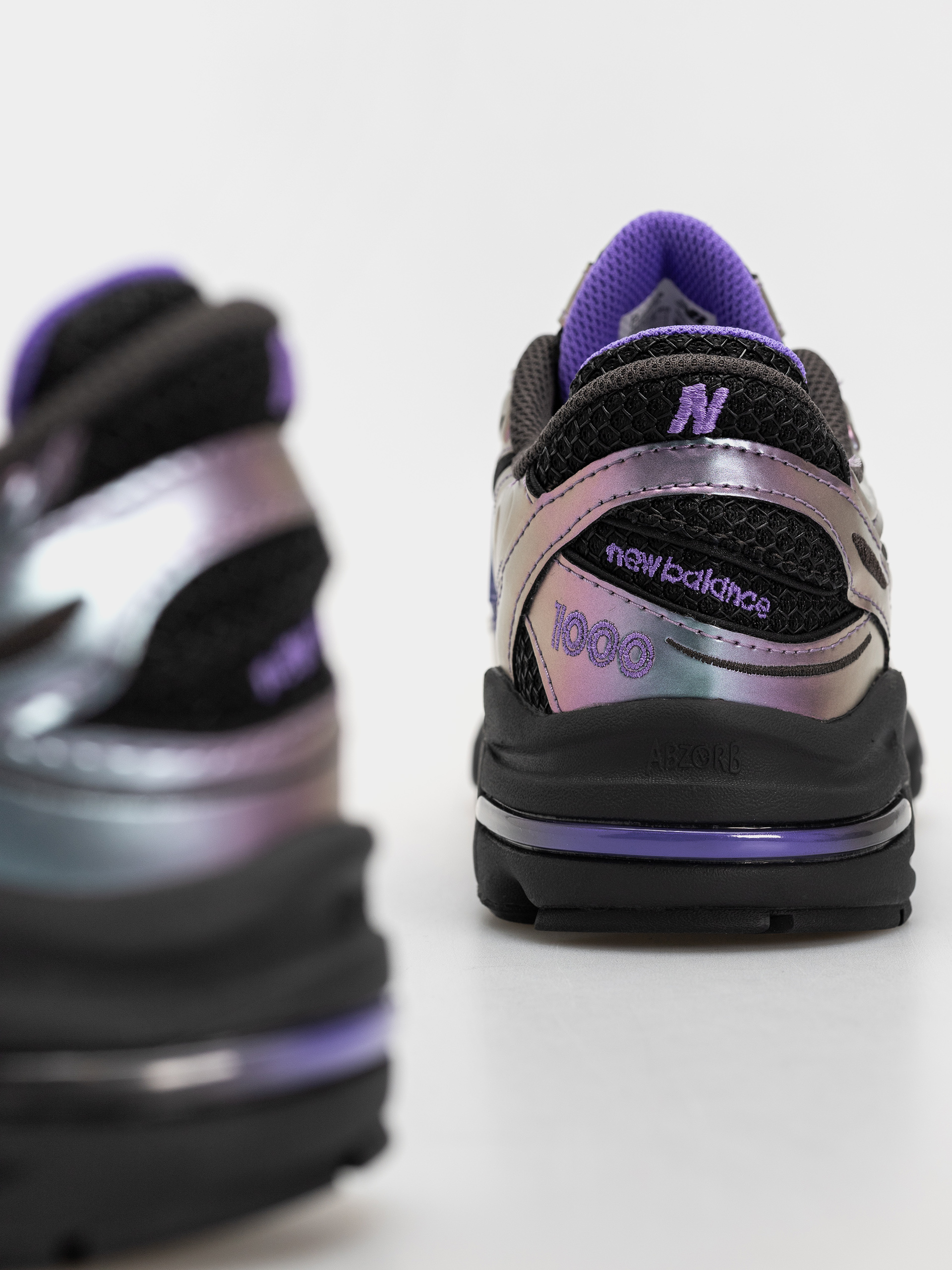 New Balance 1000 Cipők (faded black/electric indigo)